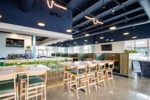 Main dining area with communal tabletop seating and booth options.